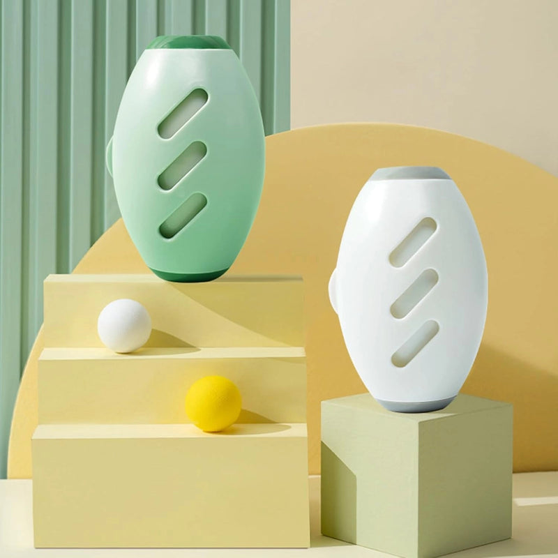 Green and white capsule-shaped reusable lint rollers on a geometric display.