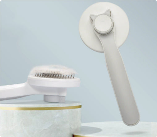 Grey self-cleaning pet grooming brush with push-button hair release