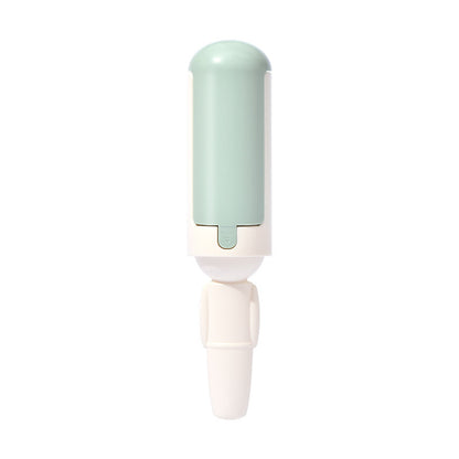 White and green reusable pet hair roller on a white background