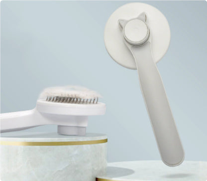 Grey self-cleaning pet grooming brush with push-button hair release
