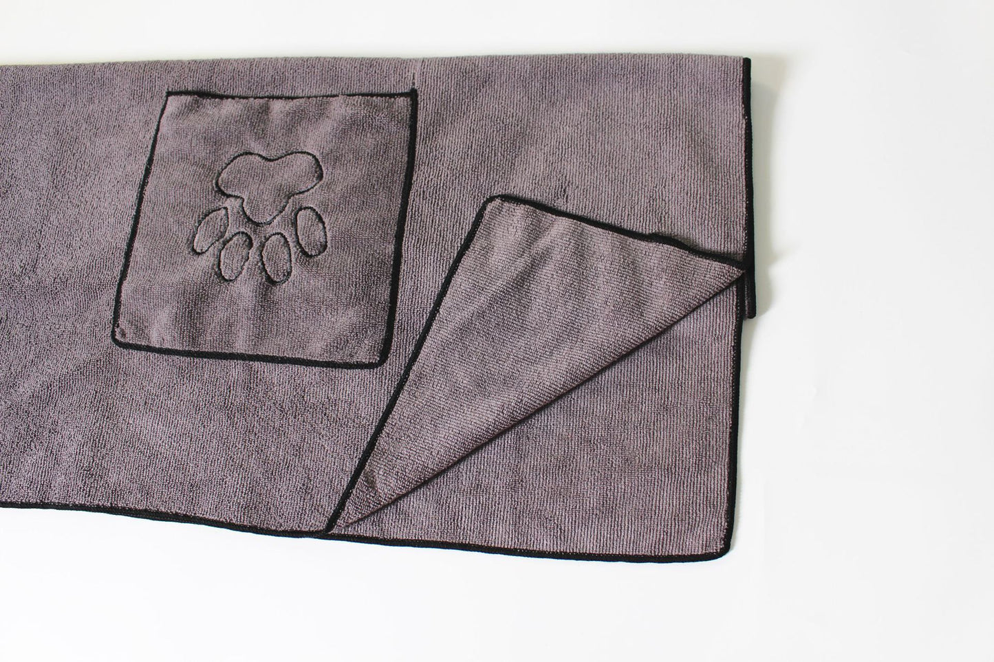 Folded gray pet drying towel with hand pocket