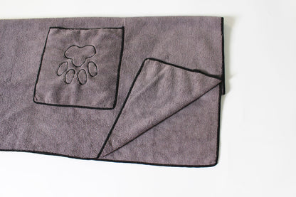 Folded gray pet drying towel with hand pocket