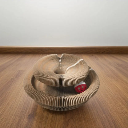 Brown accordion cat scratcher arranged in two connected circular tiers on a wood floor.