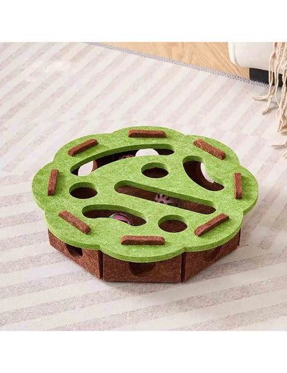 Green round felt cat puzzle with brown base and bell balls inside