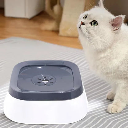 Cat drinking from the gray floating disc in a white pet water bowl.