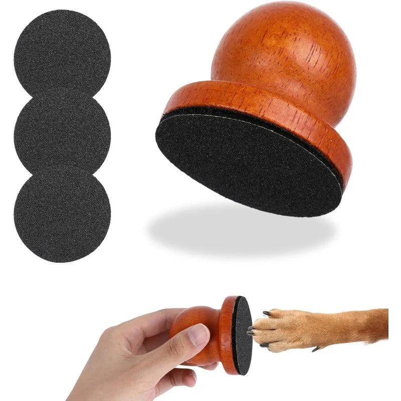 Wooden palm nail file with three black replacement sanding pads and an inset paw-filing view.