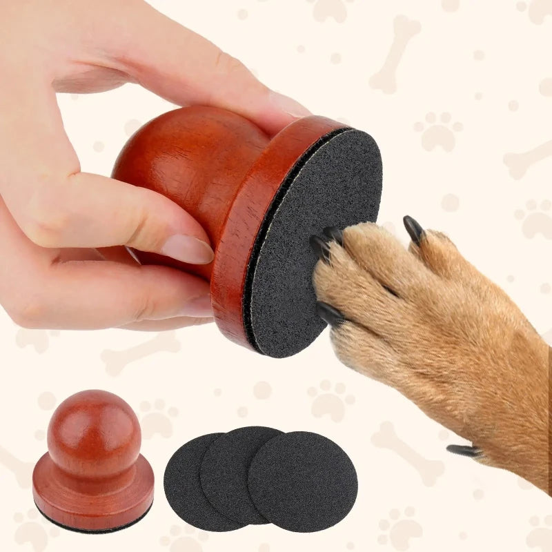 Wooden palm nail file with black sanding surface and three sandpaper pads