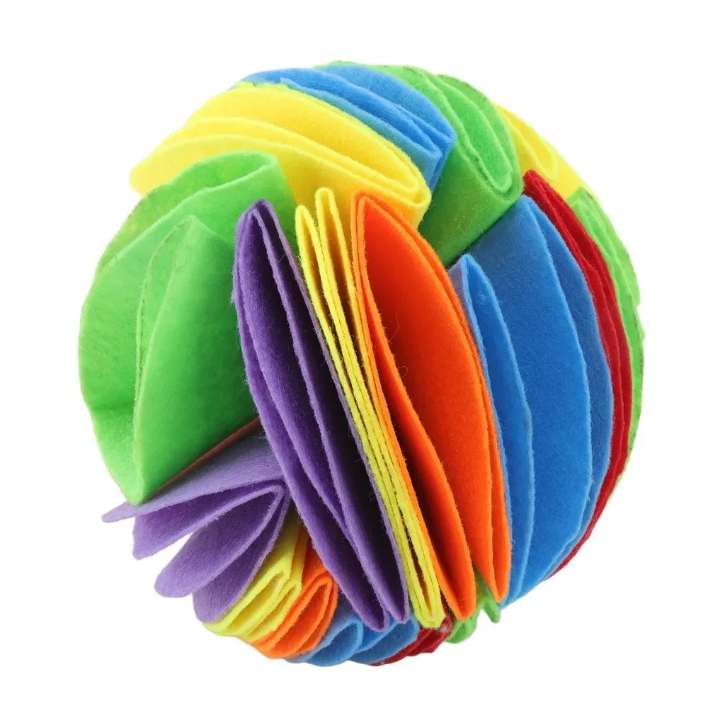 Side view of the rainbow foldable felt snuffle ball on a white background.